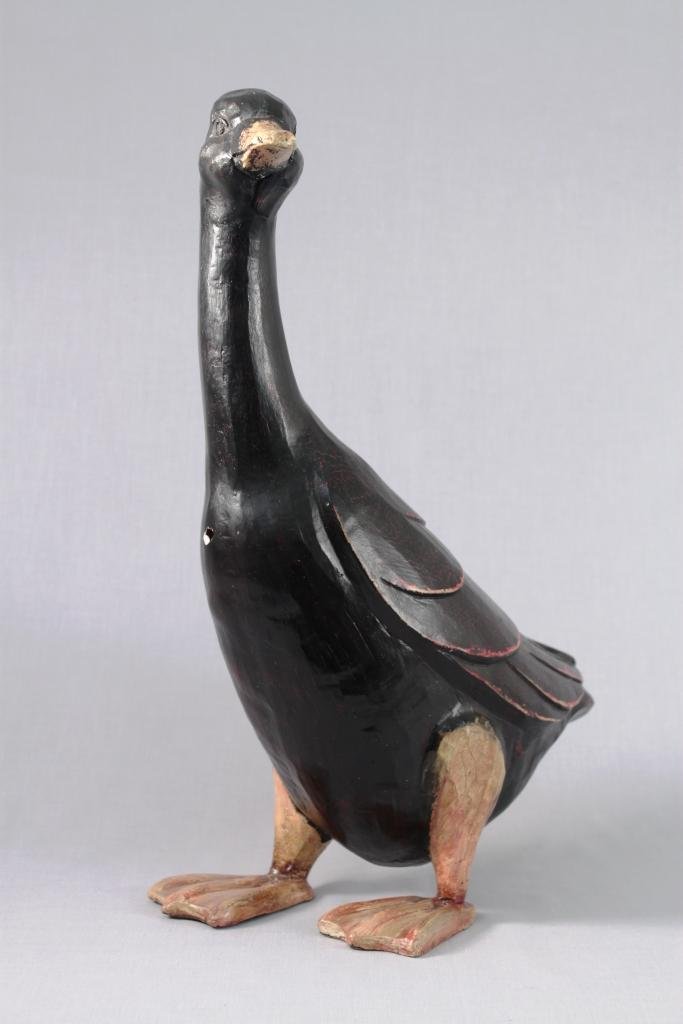 Decorative Black Duck: measures 16" tall, and has a small hole. unknown composition statue