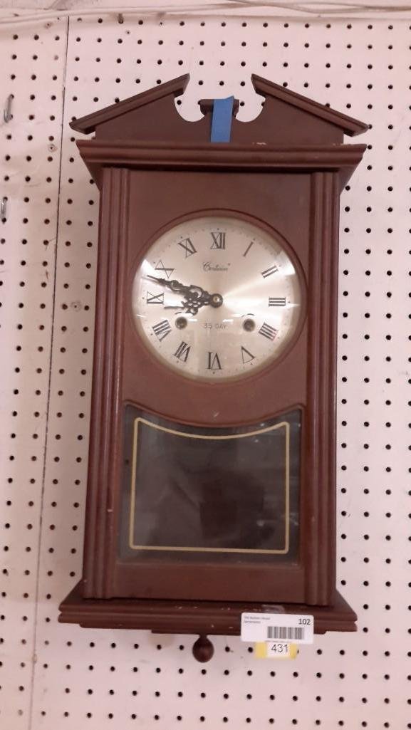 Centurion Wood Cased Wall Clock: 35 day, measures 22" tall. Good Condition.