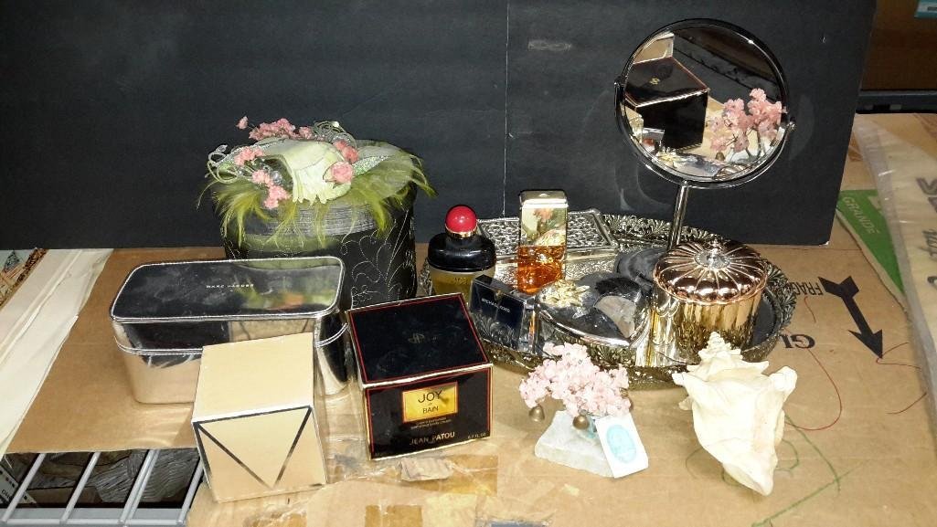 Ladies Vanity Assortment: Magnifying mirror, White Shoulders and Joy De Bain perfume, Joy De Bain perfumed body cream, Michael Kors candle (not used), Lancome shower gels, Revlon Mascara (new in package), make-u