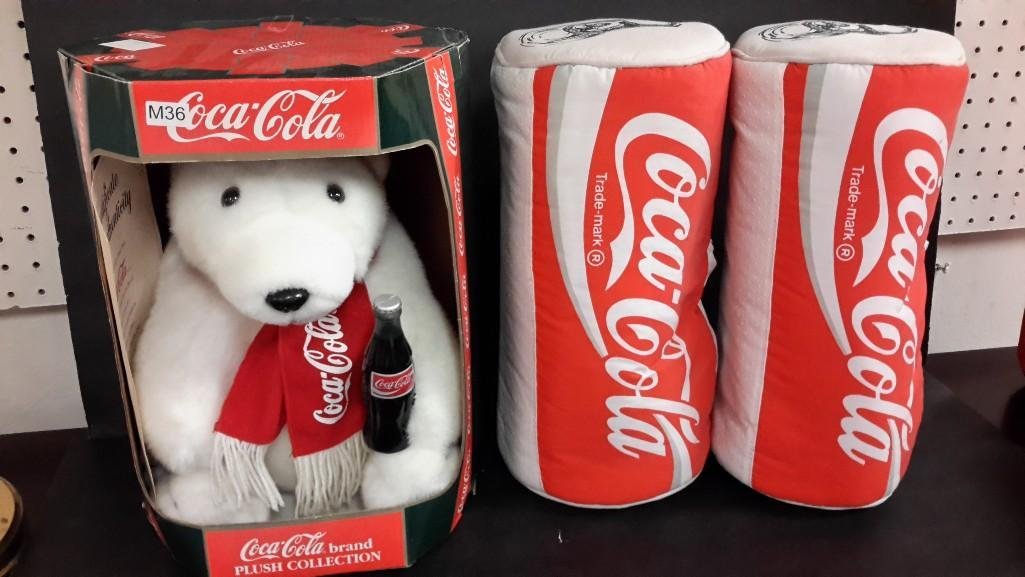 Coca-Cola Collectibles (3): Coca- Cola Plush Collection bear, new in the box, dated 1993, includes certificate, measuring 13" tall and 10" wide in box. Includes 2 coca-cola can slippers, adult size XL. 