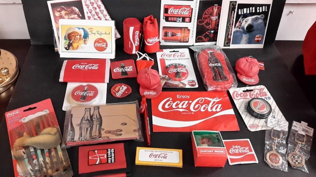 Small Coca- Cola Collectibles: Eye glass case new in package, pens, stickers, yo-yo, keychain, magnet, patches, and more. 