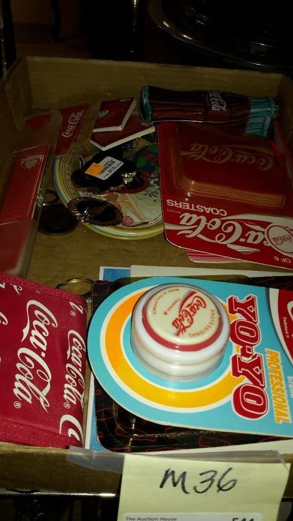 Small Coca-Cola Collectibles: Yo-Yo, coasters, change purse, magnets, small metal trays and more.