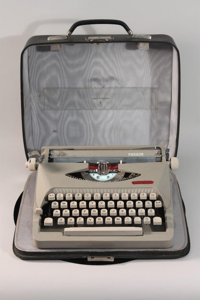 Portable Parade Typewriter: Comes in carrying case. Good condition.