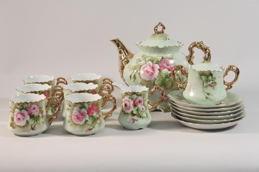 Lefton China Floral Tea Set (16): Pink and Green floral design with gold trim, tea pot is 9" wide, cream and sugar, and (6) cups and saucers all are in very good condition
