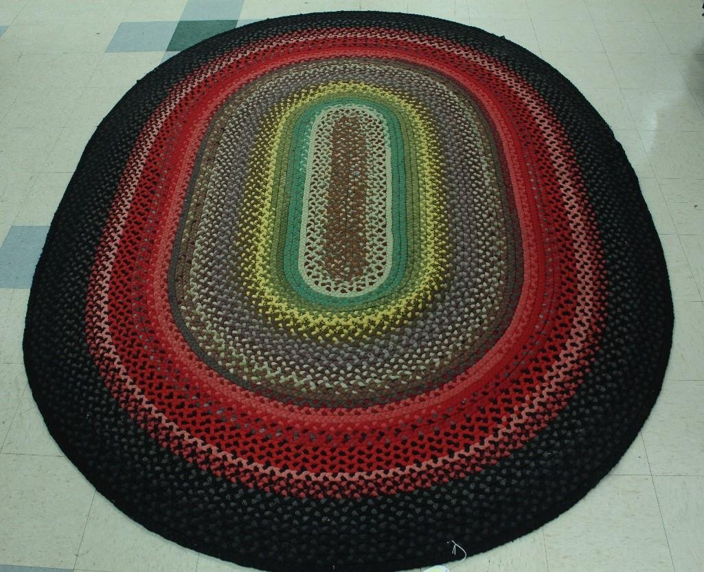 Large Oval Braided Area Rug: Measures 111" long, 84" wide, last 6" of final braid is unattached, otherwise in good condition