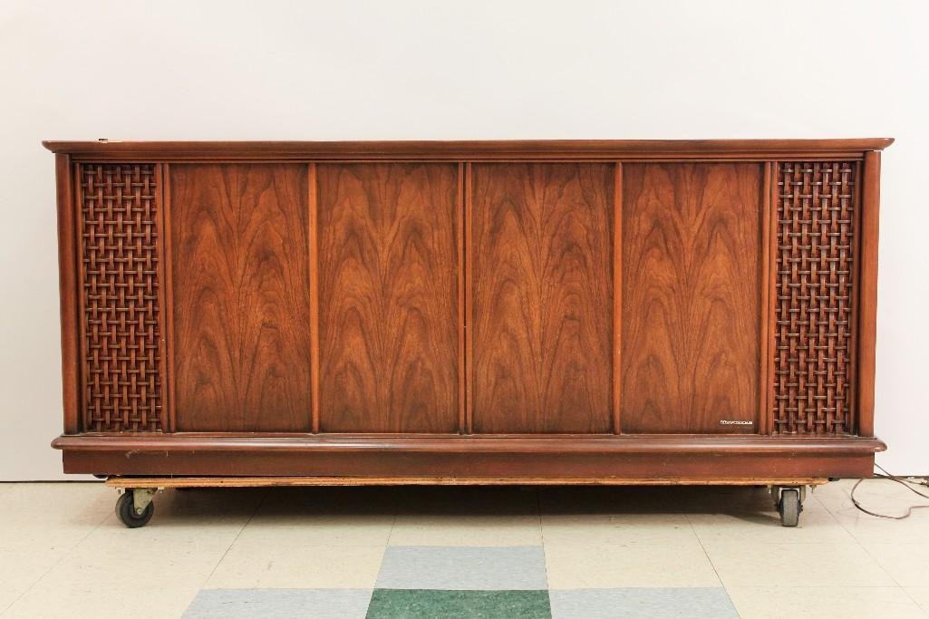 Magnavox Astro-Sonic Phonograph Radio System: Wood Floor Cabinet, Model stereo; system, AM/FM radio, turn table and album storage, 66" x 27" x 19.5", has chipped edge otherwise in good condition