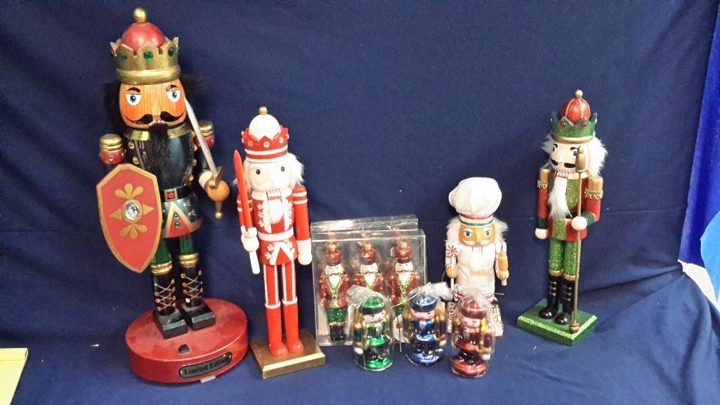 Christmas Nutcrackers (9): One animated Musical nutcracker 20" tall. Three nutcracker candles, two packages of ornaments and three other nutcrackers.