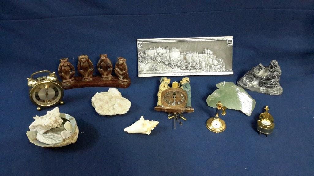 Rocks, Sea Shells and Table Decor: A Wall Plaque of Edinburgh Castle, 4 clocks, sea shells, rocks and wooden monkeys.