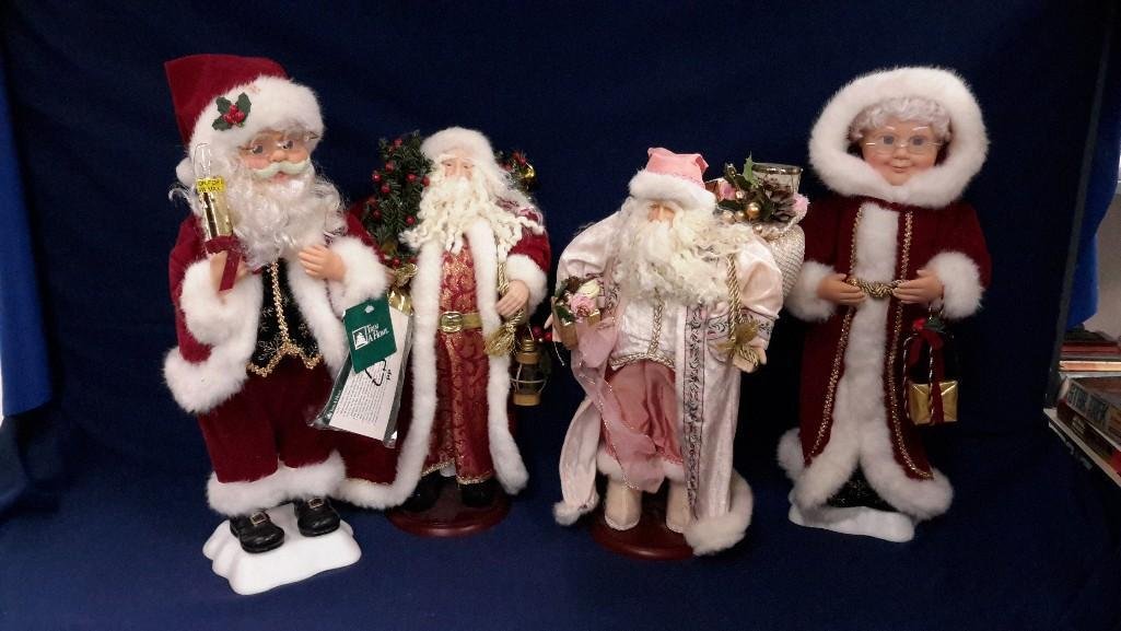 Mr. and Mrs. Claus Christmas Figures (4): Mr and Mrs. Claus are 19" tall and are missing power cords for music. Pink Santa stands 16" tall. Santa holding lantern is 17" tall. 