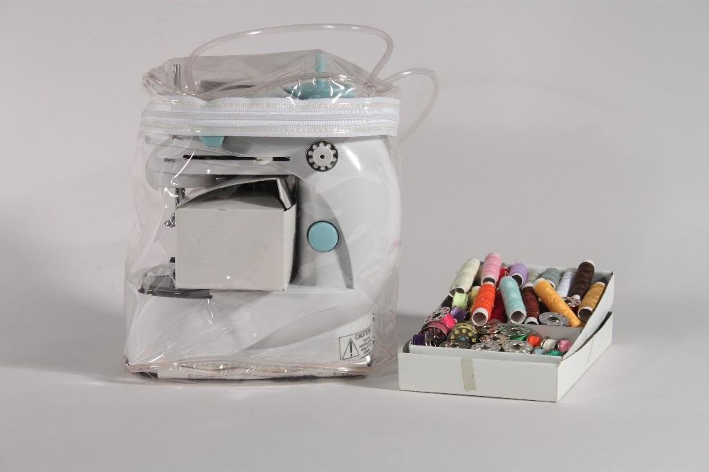 The Personal Sewer Sewing Machine and Accoesories: Comes with foot peddle, ac adaptor, carrying case and manual. Comes with thread and bobbins.