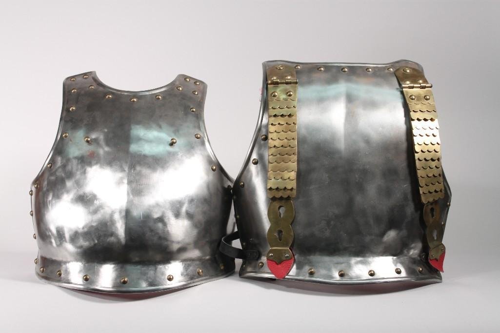Reproduction Medieval Armor Chest Plate: Silver metal with brass shoulder straps and leather waist strap. Also lined with red and white fabric.