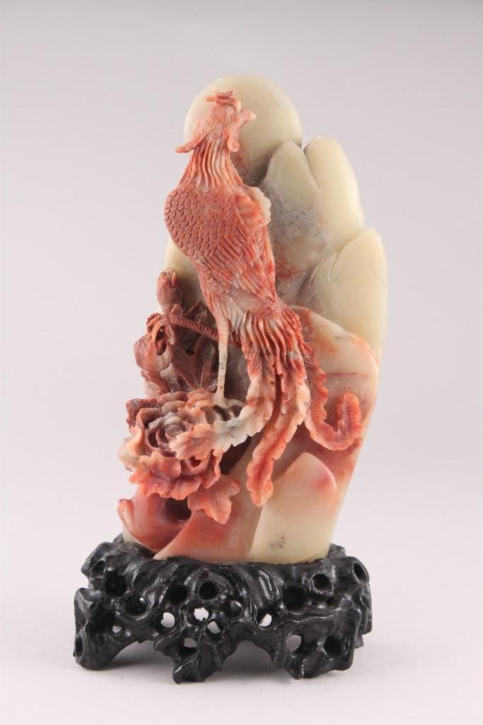 Chinese Soapstone carved Phoenix: Vintage or Antique Delicate carved soapstone figurine, Coral & greenish shades of carved Phoenix, mountain and moon. Stands 8" tall on fitted stand. Natural cracks in the stone.