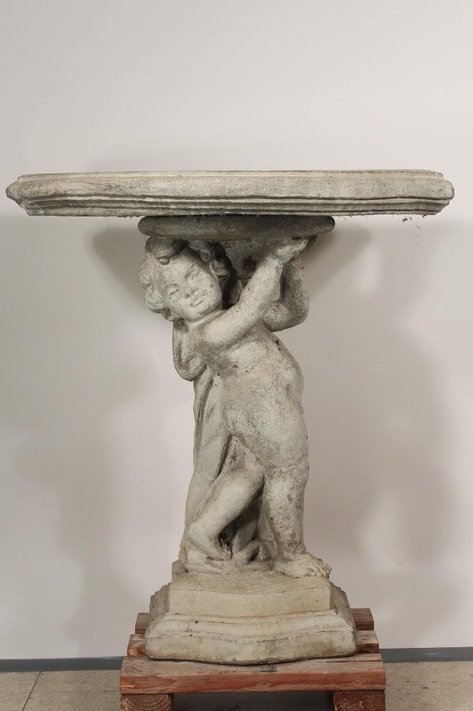 Cement Garden Wall Table: Child figurine base, measures 32 inches wide, 34 inches tall and 18 inches deep. Top has some small cracks otherwise in good condition.