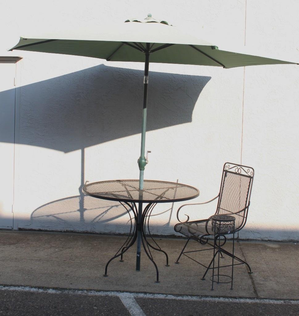 Black Metal Garden Furniture and Umbrella: One round table, 42 inches in diameter, one matching chair 39 inches tall and 22 inches wide. One black metal plant stand, 24 inches tall and a fabric umbrella.