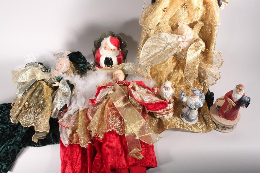 Christmas Decor: (7) Angel tree toppers all are in new condition, ceramic Santa, and other Santa figurines 