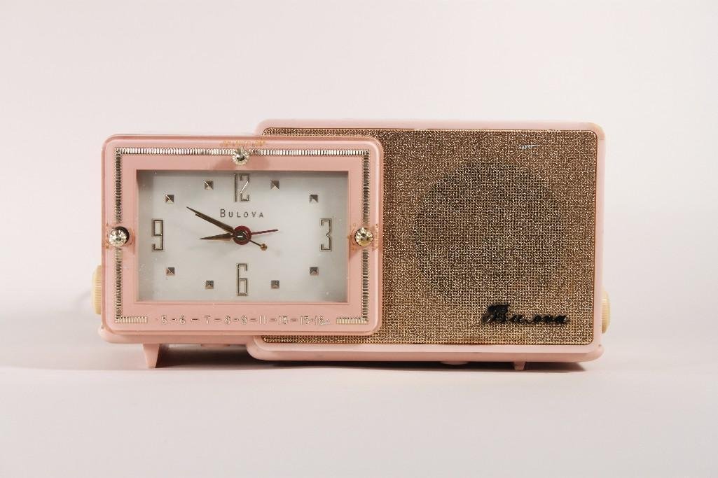 Vintage Bulova Clock Radio: Model 100, pink plastic encasement, clock works radio may need to be repaired, good condition