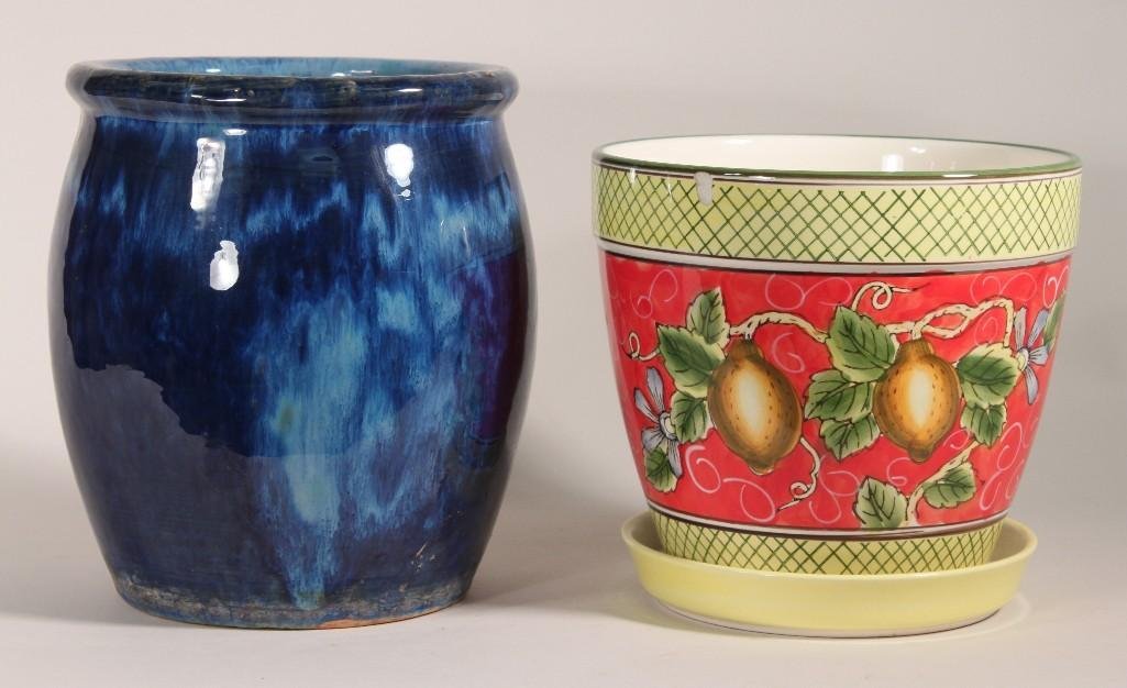 Planters (2): Blue pottery planter measures 9" tall, lemon themed ceramic planter measures 7.5" tall, has a small chip on the rim. 