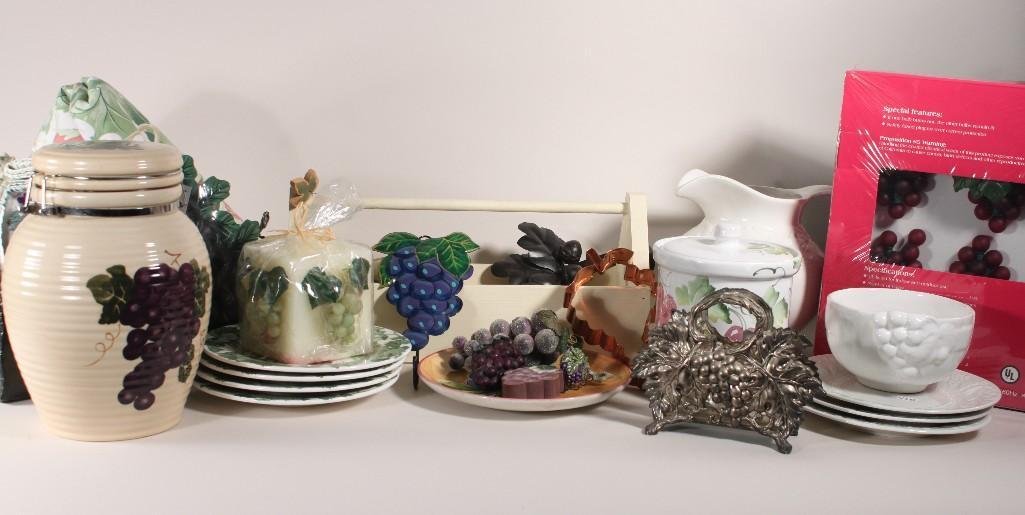 Grape Leaf Decor: Items include: two boxes of red grape cluster lights, glass serving bowl, 10" tall cookie jar, candle, plates, Crate and Barrel ceramic water pitcher, and more.