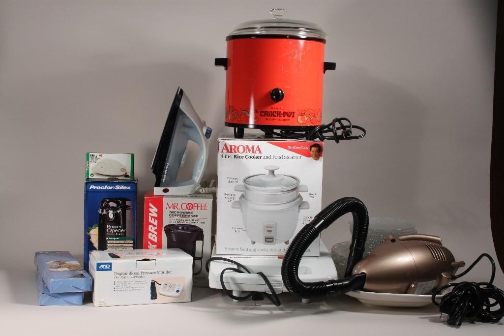 Small Kitchen Appliances and Dish Ware: Lot includes Rival crock pot, Aroma rice cooker and food steamer, Toastmaster waffle baker, Digital blood pressure monitor, clear glass dishes and more 