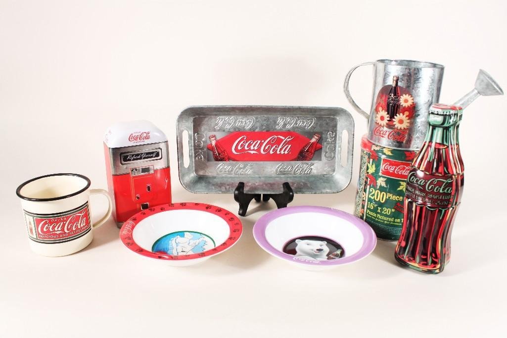 Coca-Cola Collectables (8): Includes plastic bowls, tins (1 with a sealed puzzle), metal mug, metal watering can, and metal tray.