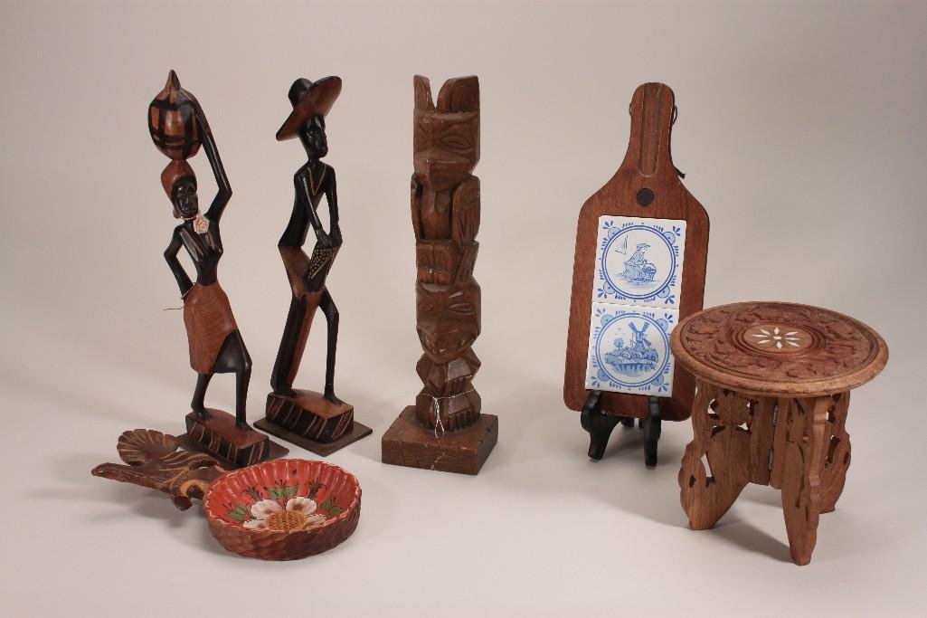 Decorative Wood Items (7): Items include:a Pacalaska genuine wood hand carved totem pole, two black Americana carved wood statues, and more.