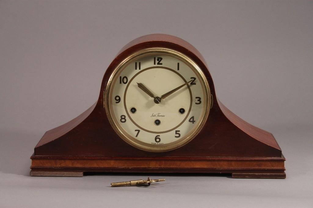 Seth Thomas Mantle Clock: Has wood encasement model number E 705-003. has wind-up key
