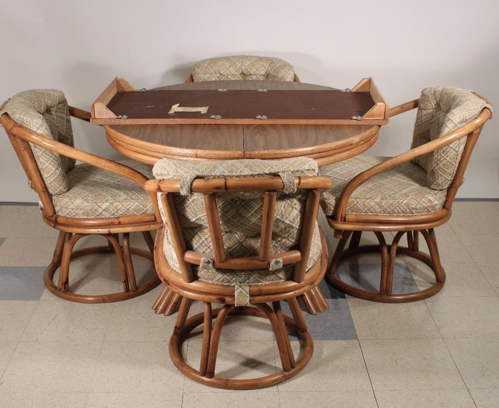 Vintage Bamboo Dining Table and Chairs (5): Four swivel chairs with upholstered cushion seats, table includes one leaf, table measures 42" without leaf, chairs are 30" tall 20 wide, shows some wear