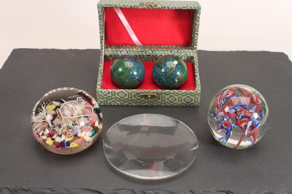 Paper Weights and Stress Balls: Multi colored glass paper weights, one reads home sweet home, and a pair of Asian style stress balls in original box, and a magnify glass 