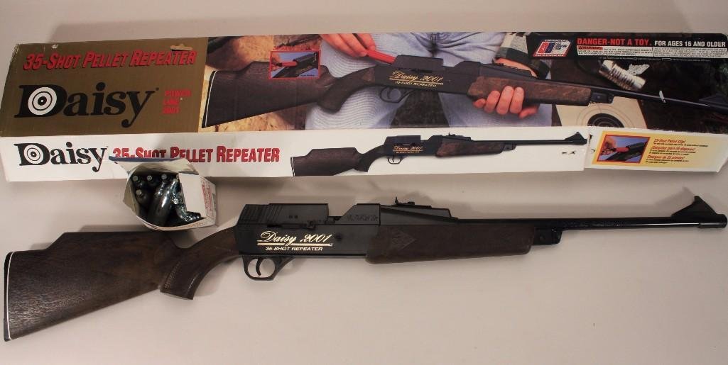 Daisy 35-shot Pellet Repeater: In original box with manual, also includes air pellet canisters