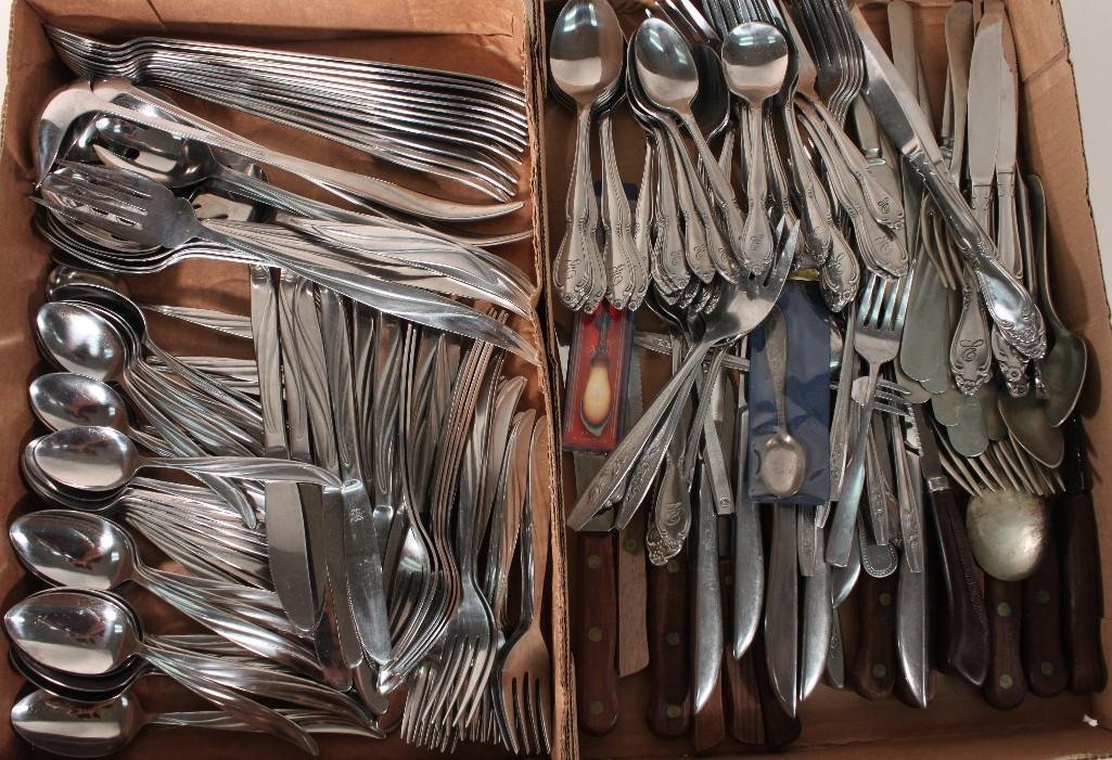 Flatware Assortment: Large two box lot includes Castle Court set with serving utensils included. Other brand of flatware include: THC, Grand Prix, Northland, Old homestead, Ginsu, and more.