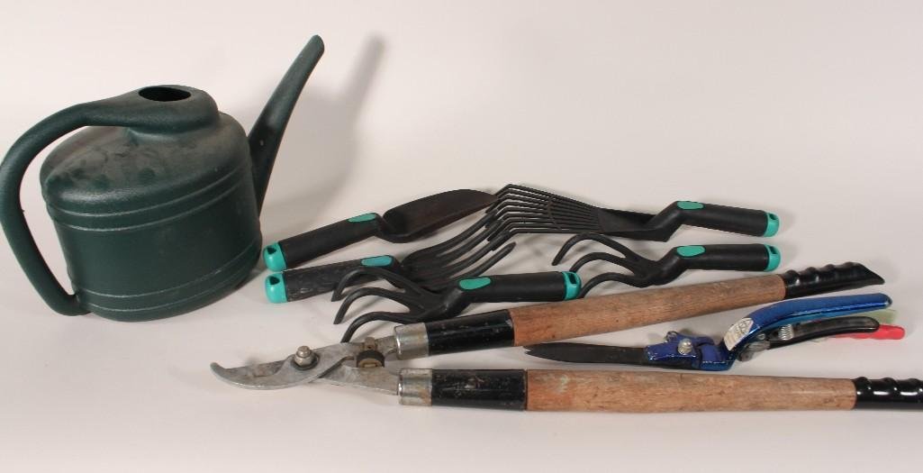 Garden Tools: Items includes: one gallon water canister, loppers, hand held racks and shovels, and more. 
