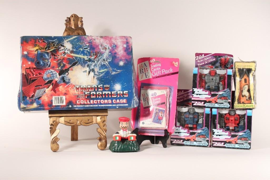 Vintage Collectible Toys: Items include (3) Robot De Combat Robot Fighter, Barbie Trading Cards, Transformers Collectors case, automated drummer figurine, and more 