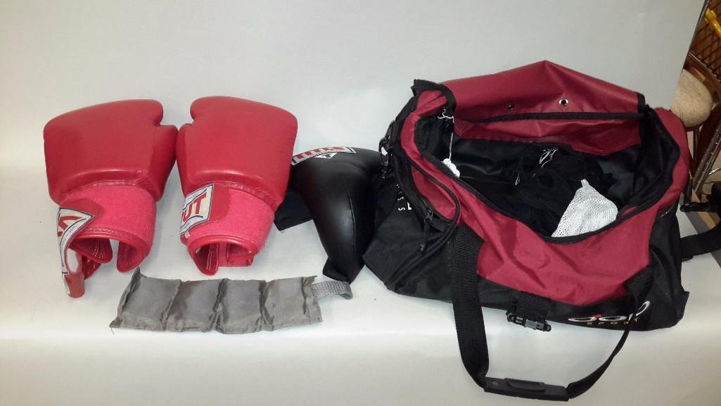Boxing Accessories: Lot includes a pair of Vut Leather boxing gloves made in Thailand, Title Boxing leather jock strap size L, Wrist or ankle wrap, comes in Pinnacle Fitness duffel bag