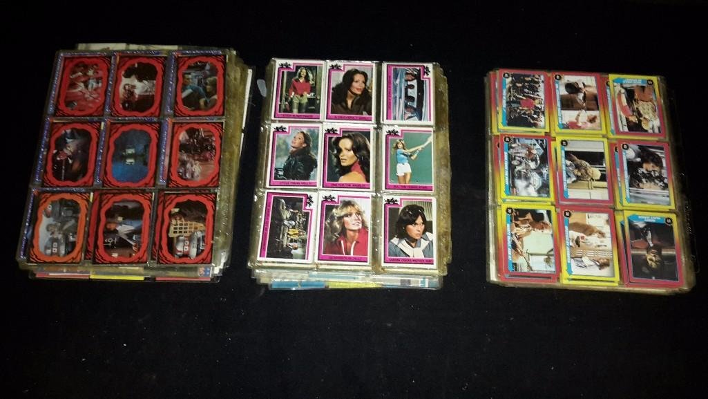 Movies, TV Series, & Flowers Trading Cards: Large assortment of trading cards in sheet protectors, The Black Hole, Charlies Angels, The Alien, Betty Boop, and more 