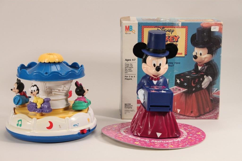 Vintage Mickey Mouse Game and Toy: Mickey Mouse spin-a-round game (original packaging), and a Disney baby Carousel toy (missing battery cover)