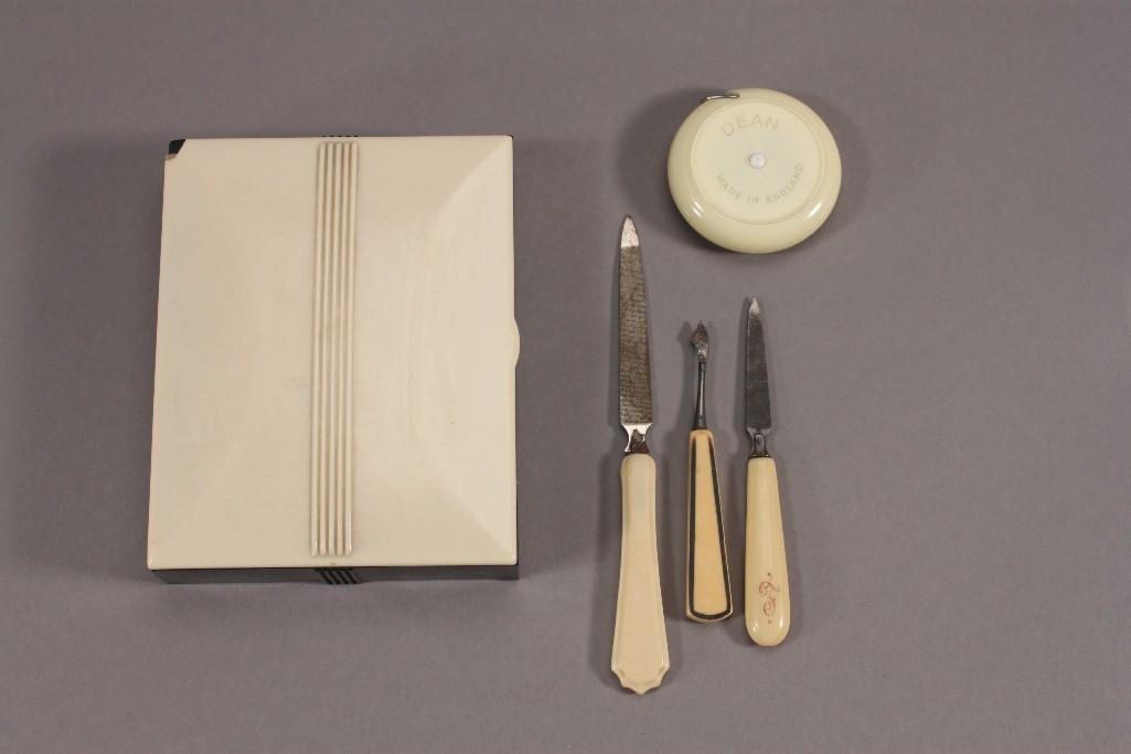 Vintage Manicure and Vanity Accessories: Three vintage mismatched manicure tools, Dritz cloth measuring tape, and a lidded vanity box that measures 4" X 5" (top right corner has a small chip).