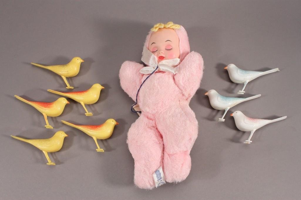 Celluloid Birds and Musical Plush Doll: 5 yellow birds and 3 white birds, all in good condition. One musical Bantam plush baby doll that measures 11" long.