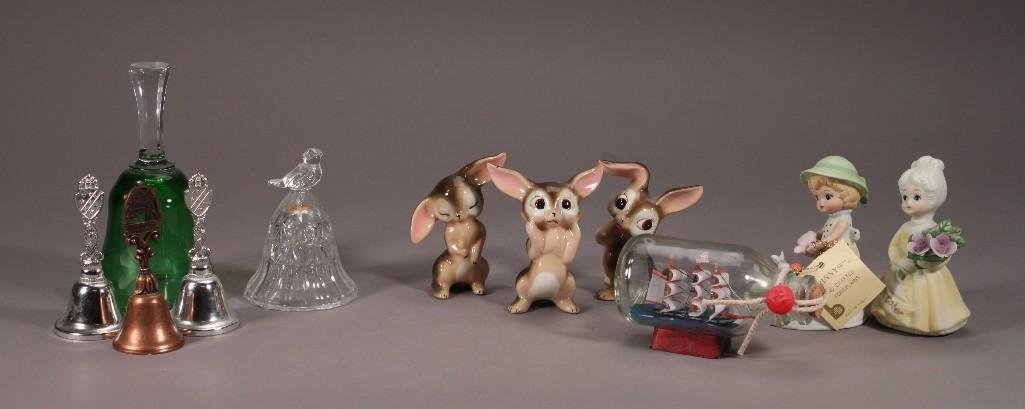 Vintage Figurines and Bells (11): Items include: 3.5" tall Bunnies marked 39 (3), three souvenir bells one marked California, San Jose California, one marked Alaska, One 6" green clear glass bell, and more.