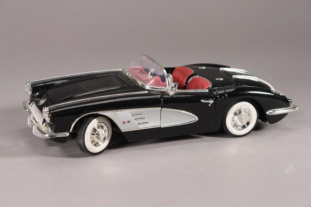 1958 Corvette Model Car: Doors and trunk open, measures 10" long, 4" wide, 2.5" tall, doors are loose, shows light wear.