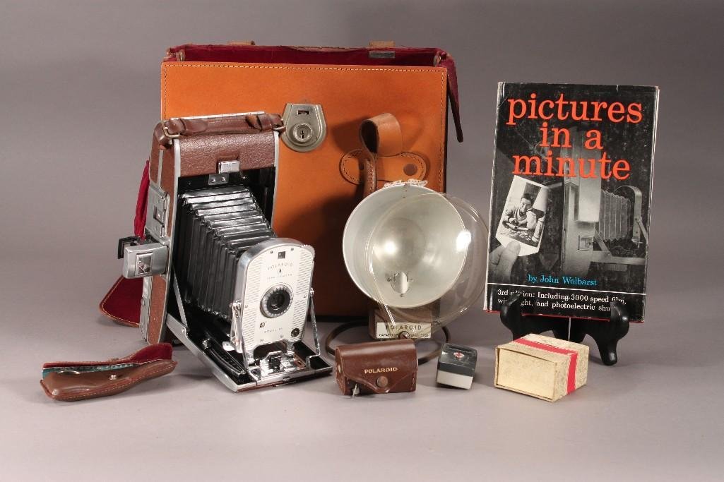 Vintage Polaroid Camera with Accessories and Case: Items Include: Polaroid Land Camera model 95, Polaroid Capacitor Flash #201, Polaroid filter kit in case, close up lens kit in case, "Pictures In A Minute" third edition book, Polaroid expos