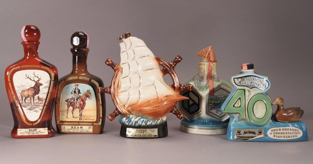 Jim Beam Vintage Decanter Collection (5): Items include: Ducks Unlimited Four Decades Of Conservation Pioneering, Deer themed decanter, a Frederic Remington decanter, Expo '74 World's Fair decanter, and a Nautical themed Decanter.