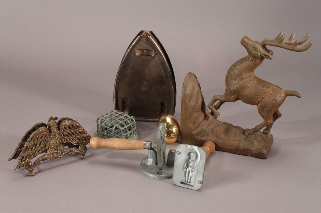 Vintage Metal Collectibles: Includes a 9" iron buck (unmarked), Green metal flower frog 3.5" diameter, 2" gold tone egg, a candy mold, and more 