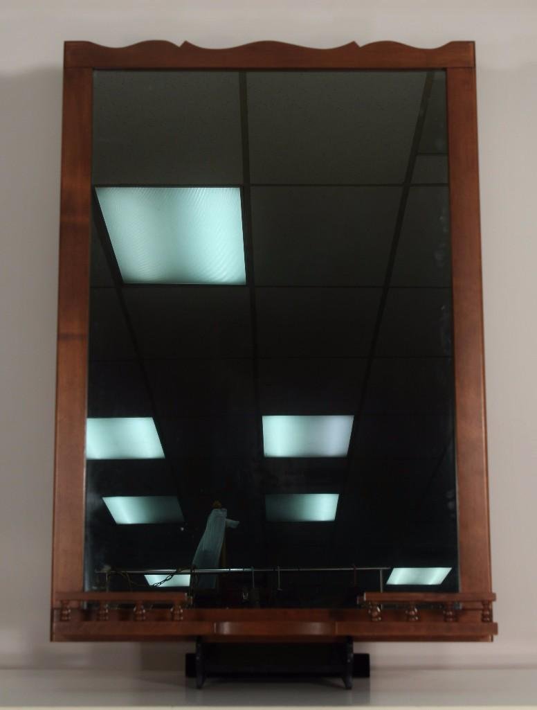 Early American Style Maple Framed Mirror: Mirror measures 27.5"x 39.5", has a bottom display shelf, in good condition.