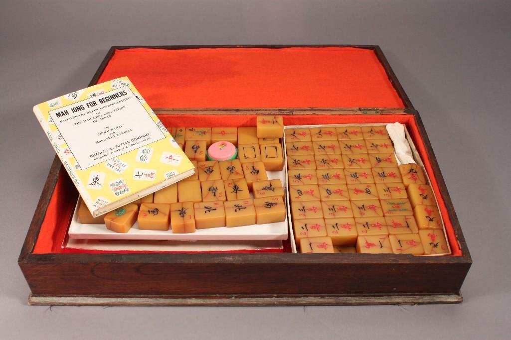 Bakelite Mah Jong: Wooden case measures 3.5"x18.5"x10", includes pieces and "Mah Jong for Beginner" book.