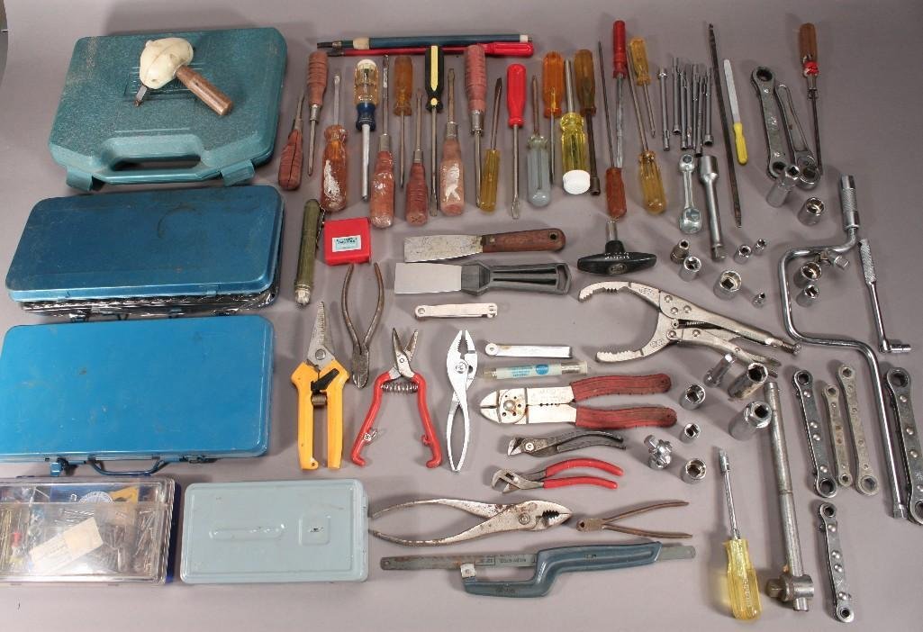 Tools: Items include box of screw drivers, 40 pc. 1/4 and 3/8 drive socket set (missing wrench), drill bit set (missing drill), pliers, nails, screws and more 