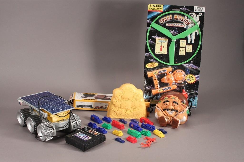 Toys: Lot includes 1991 plastic taco guy, Space Mission Star Flyer (still in original package), moon rover remote control car, and more.