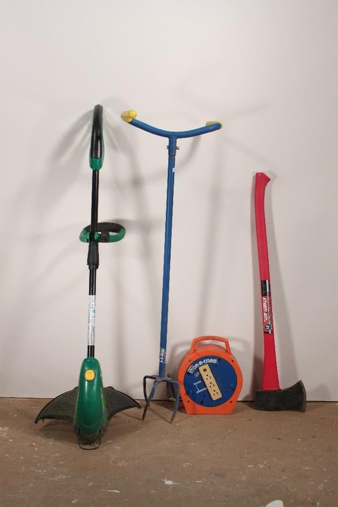 Garden Tools: Includes tree temper long lasting fiberglass handle ax 34" long, Garden claw 41" tall, snapit stor-a-cord, and a weed whacker, 