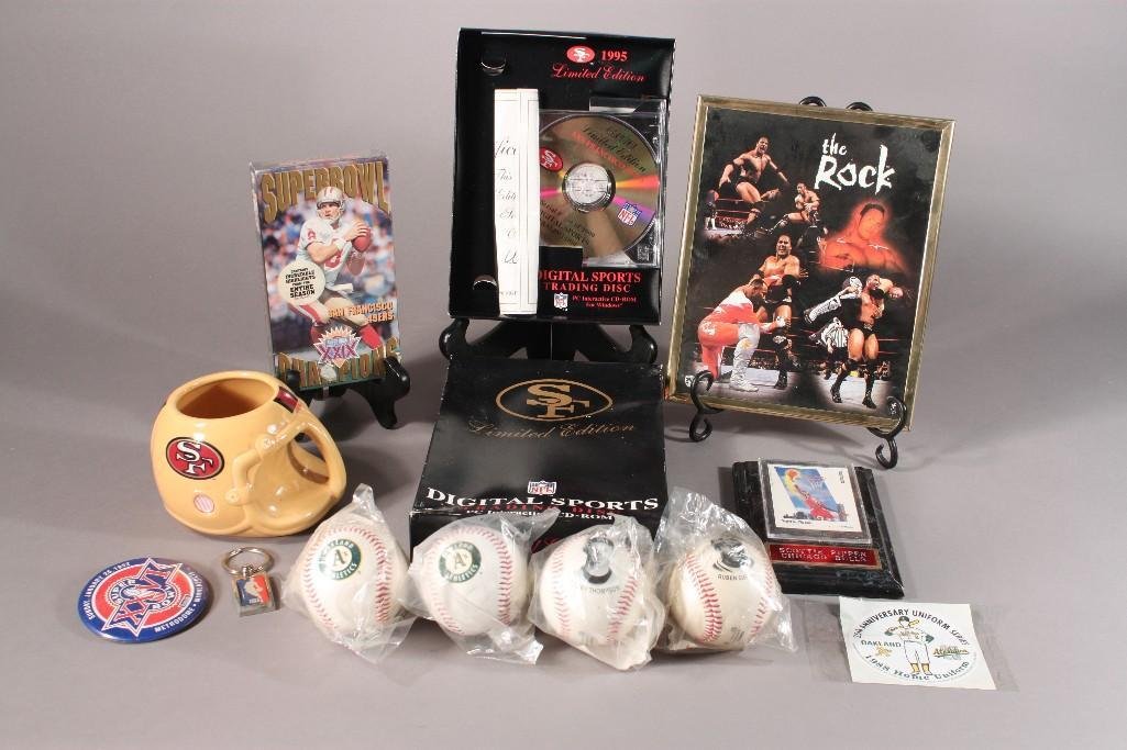 Sports Memorabilia: Includes 49er mug, superbowl 29 vhs, 1993 photo baseball, the Rock framed photo, 1995 limited edition digital sports trading disk, and more 