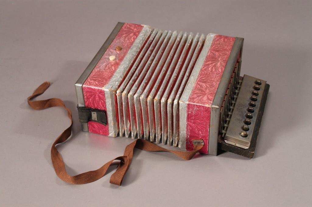 Vintage German Concertina Squeezebox: measures 10"x7", shows age and wear, works but may need repair, marked made in Germany