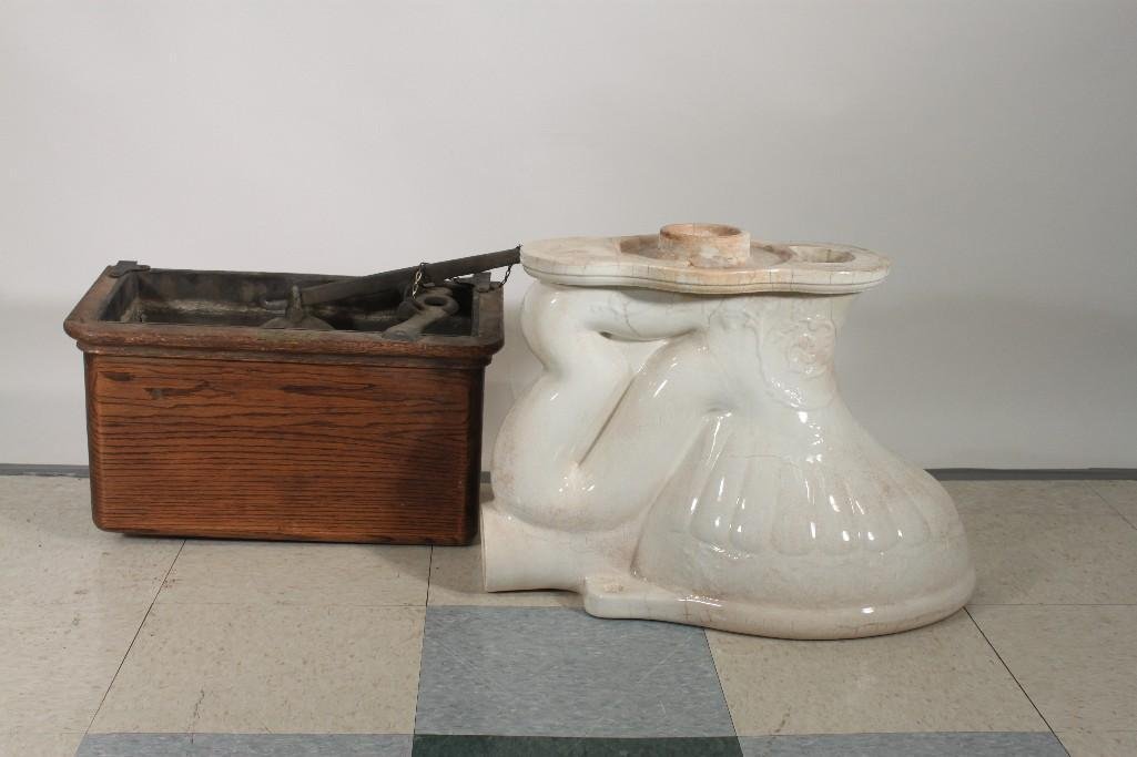 Vintage Porcelain Toilet with Wall Tank: Ornate porcelain toilet bowl, has several cracks in the finish, includes a wood wall mounted tank and accessories, needs to be repaired